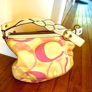 Coach Signature Hobo multicolor logo pattern on cream canvas and leather purse